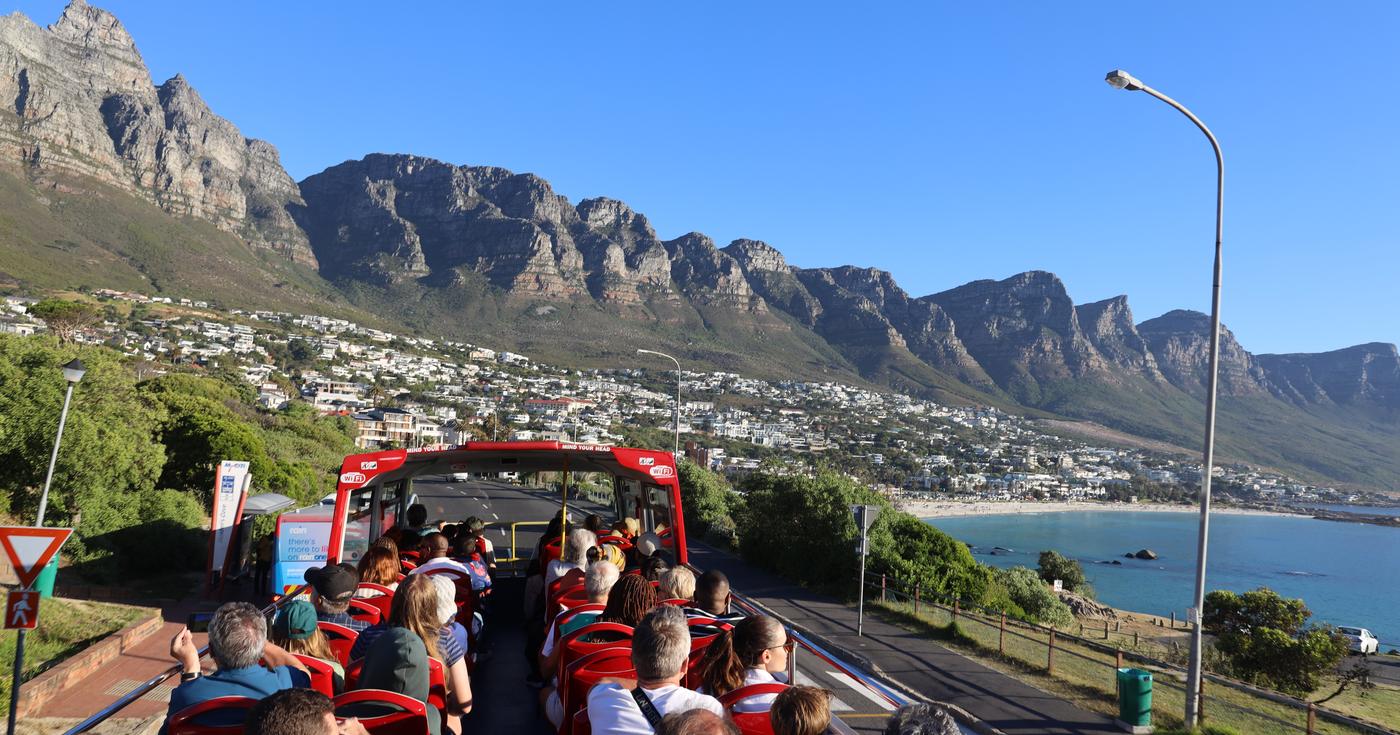City Sightseeing bus above Camps Bay with the Twelve Apostles, Cape Town